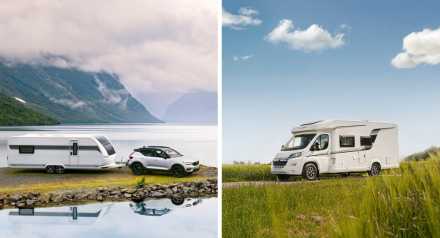 Husvagn bakom bil vid sjö och husbil på landsväg