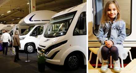 Husbilar på rad och liten flicka på insteg